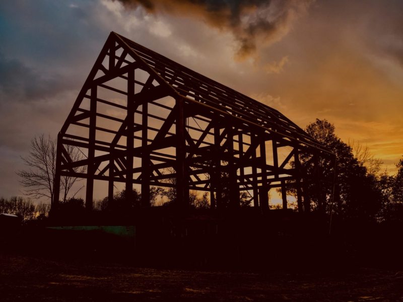photo of framed barn at sunset